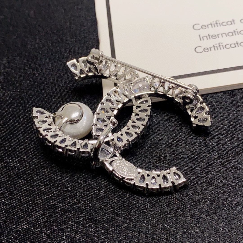 Ch**el brooches